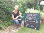Volunteer with updated SACV&nbsp;chalkboard
