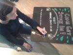Volunteer working on SACV&nbsp;chalkboard